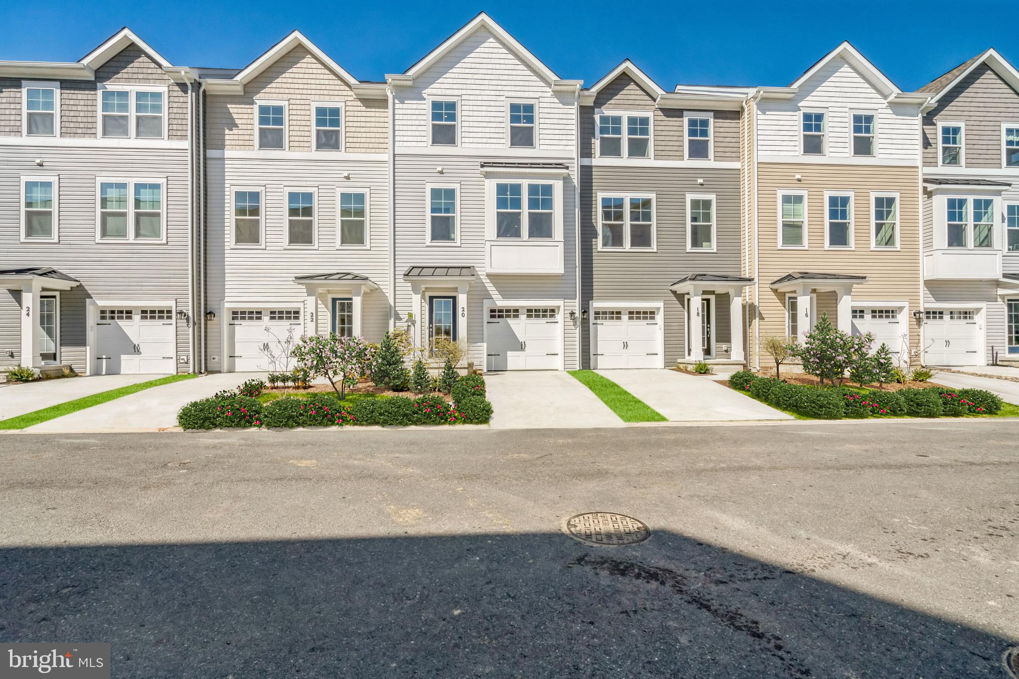 20 Riverside Drive Cambridge, MD 21613 - Photo 3 of 17 a view of multiple houses with a yard and plants