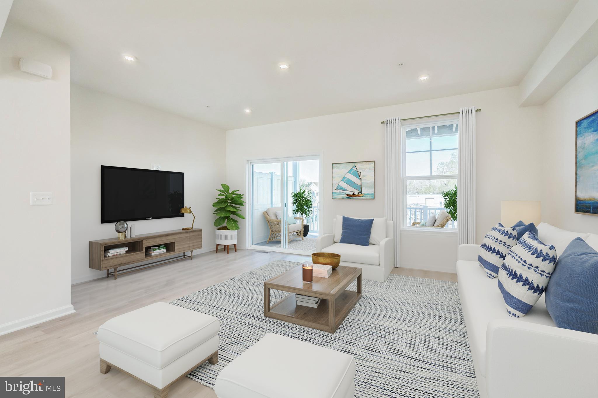 20 Riverside Drive Cambridge, MD 21613 - Photo 5 of 17 a living room with furniture and a flat screen tv