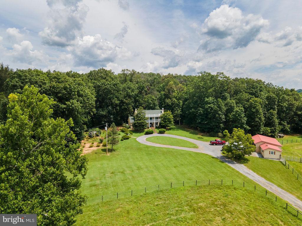 1115 Chapel Road Middletown, VA 22645 - Photo 11 of 54 a view of an chairs and table in the backyard
