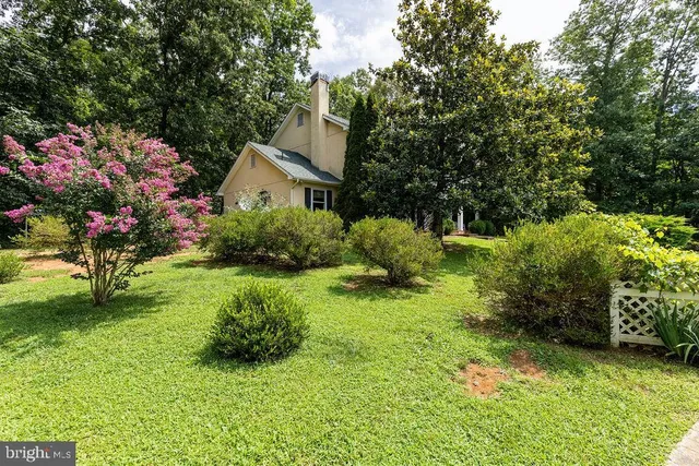 a view of a back yard with a patio