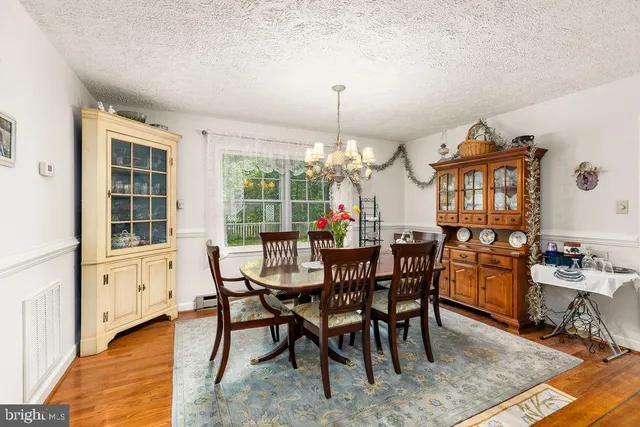 a kitchen with sink refrigerator and window