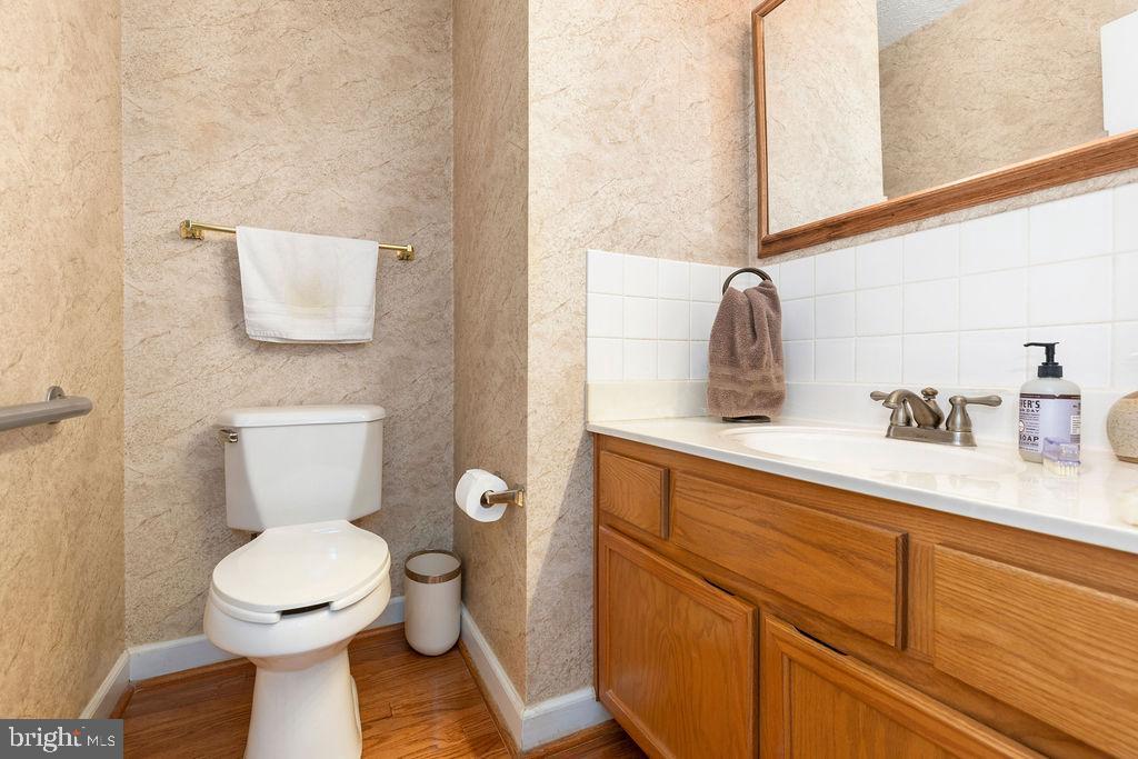 1115 Chapel Road Middletown, VA 22645 - Photo 30 of 54 a bathroom with a toilet sink and mirror