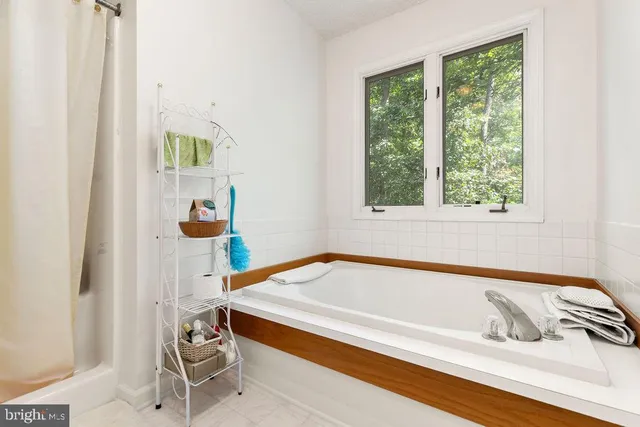 a bedroom with furniture and a flat screen tv