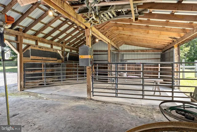a front view of a house with yard and parking