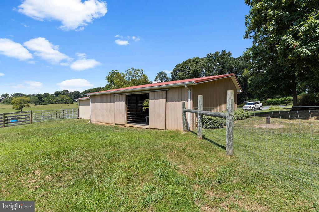 1115 Chapel Road Middletown, VA 22645 - Photo 50 of 54 a backyard of a house with table and chairs
