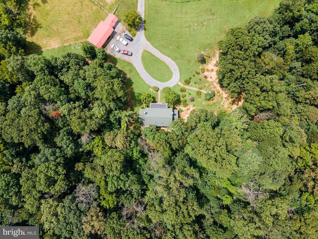 1115 Chapel Road Middletown, VA 22645 - Photo 9 of 54 an aerial view of a house with a yard and wooden fence