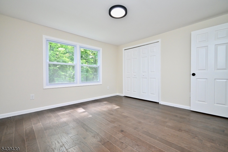 1 Appleseed Road Sussex, NJ 07461 - Photo 9 of 19 an empty room with wooden floor and windows