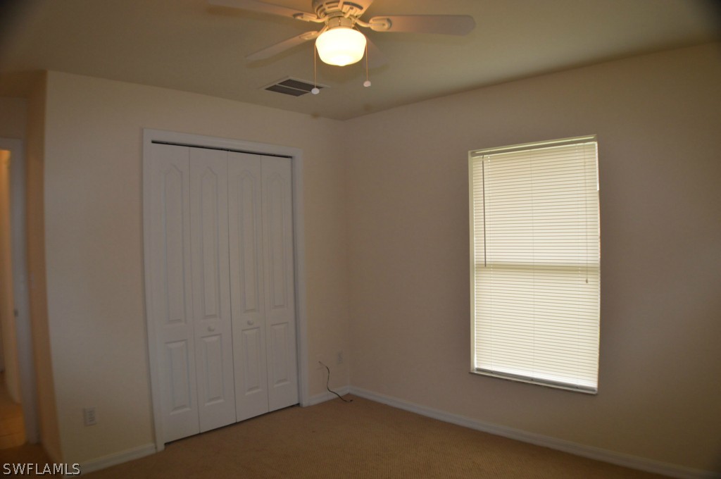 134 Ridgemont Drive Lehigh Acres, FL 33972 - Photo 11 of 14 an empty room with a window