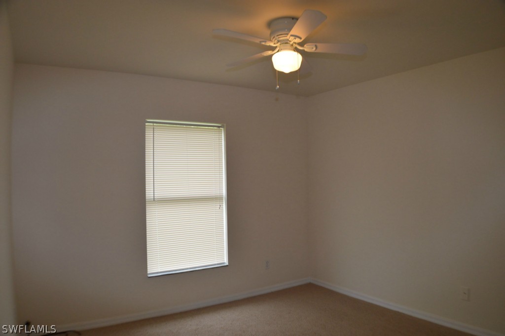 134 Ridgemont Drive Lehigh Acres, FL 33972 - Photo 9 of 14 an empty room with a window