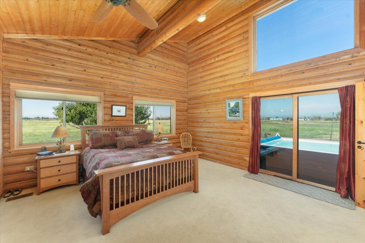 4208 Balls Ferry Road Cottonwood, CA 96022 - Photo 12 of 53 a bedroom with a bed and a balcony view