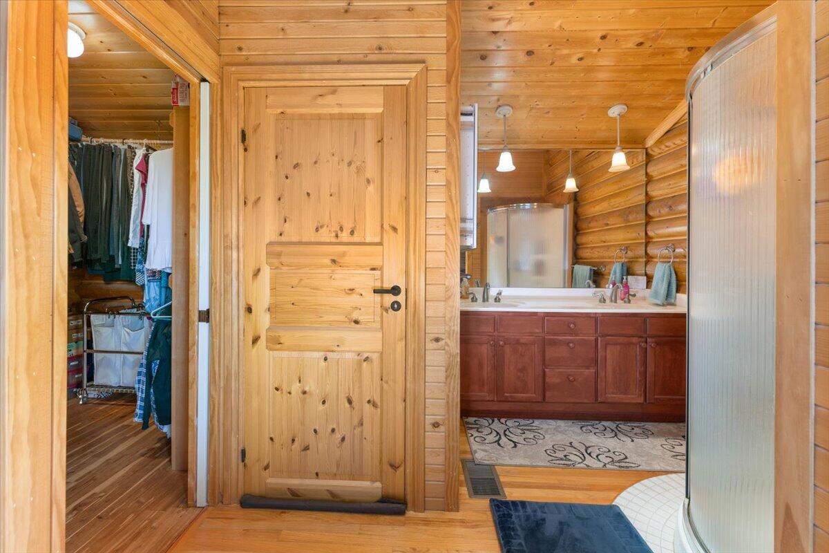 4208 Balls Ferry Road Cottonwood, CA 96022 - Photo 16 of 53 a view of a hallway with wooden floor and cabinet