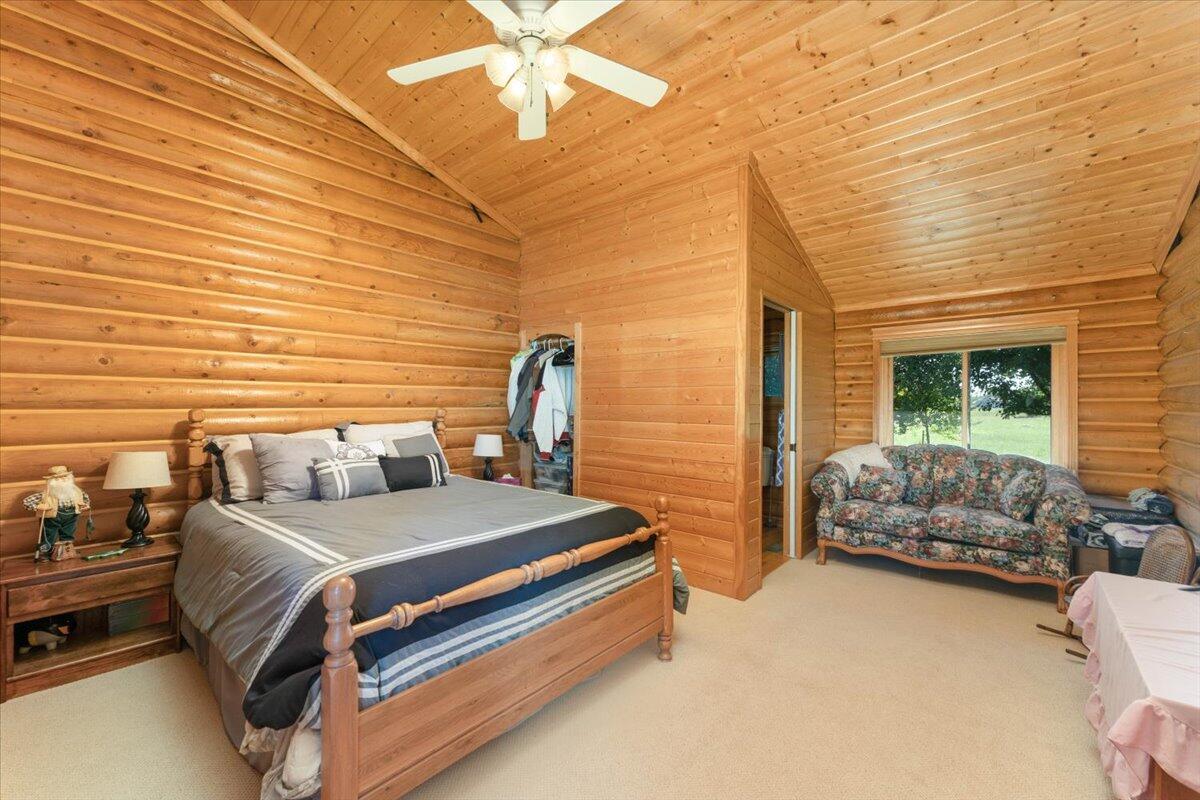 4208 Balls Ferry Road Cottonwood, CA 96022 - Photo 18 of 53 a bedroom with a bed and a couch