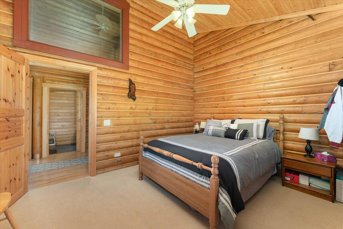 4208 Balls Ferry Road Cottonwood, CA 96022 - Photo 19 of 53 a bedroom with a bed and a ceiling fan