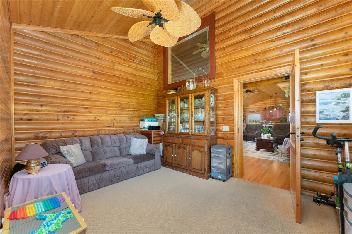 4208 Balls Ferry Road Cottonwood, CA 96022 - Photo 26 of 53 a living room with furniture and a fireplace