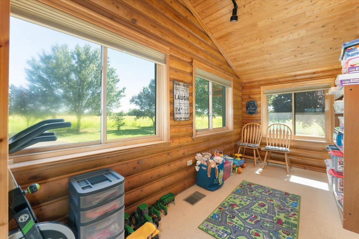4208 Balls Ferry Road Cottonwood, CA 96022 - Photo 27 of 53 a bedroom with furniture and a large window