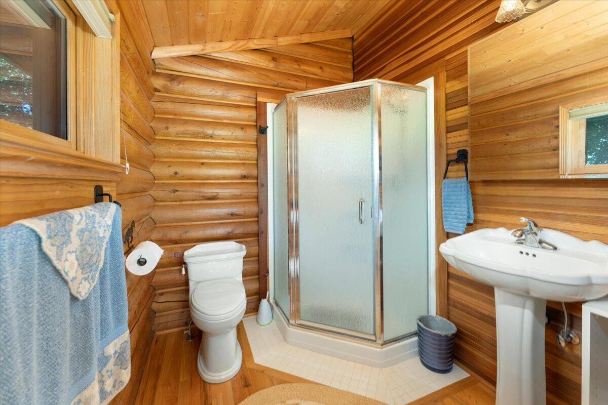 4208 Balls Ferry Road Cottonwood, CA 96022 - Photo 28 of 53 a bathroom with a sink mirror and toilet