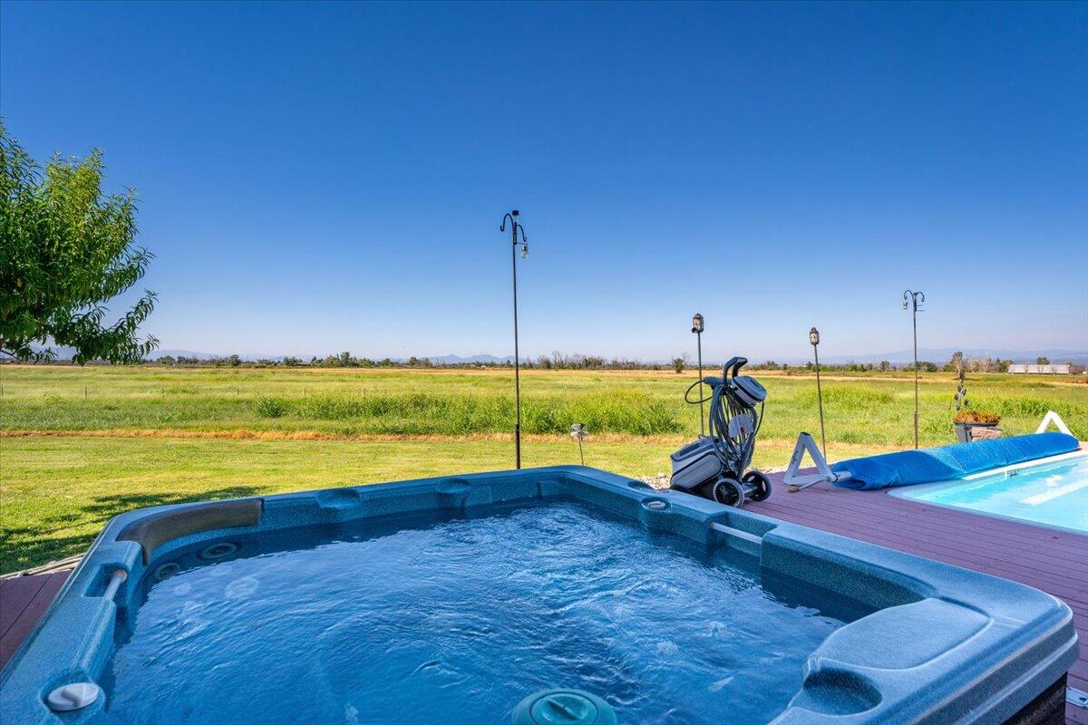 4208 Balls Ferry Road Cottonwood, CA 96022 - Photo 33 of 53 a view of a swimming pool and lounge chairs