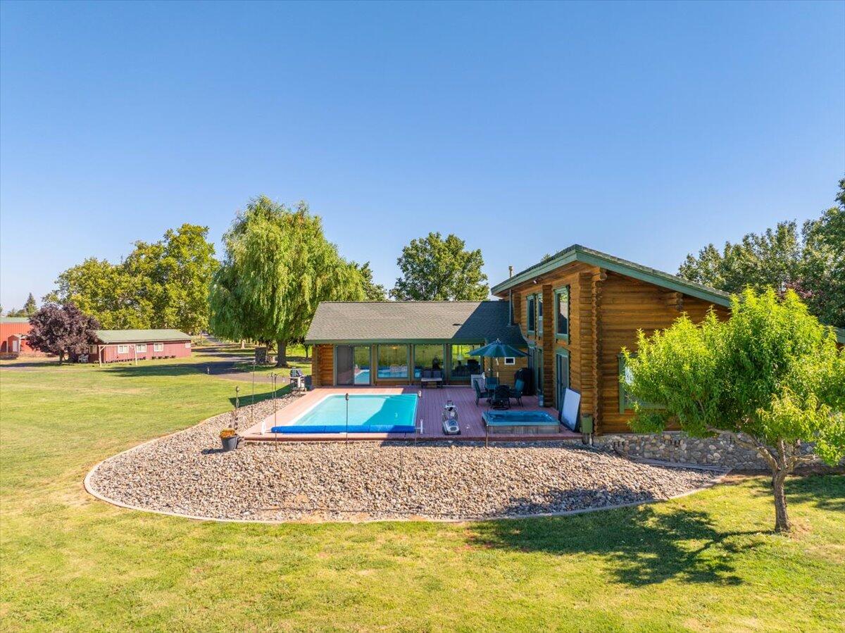 4208 Balls Ferry Road Cottonwood, CA 96022 - Photo 42 of 53 a swimming pool with outdoor seating and yard