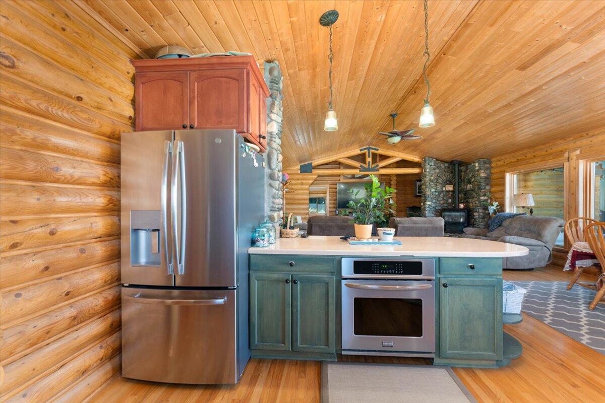 4208 Balls Ferry Road Cottonwood, CA 96022 - Photo 8 of 53 a kitchen with stainless steel appliances granite countertop a refrigerator a stove and a wooden floors