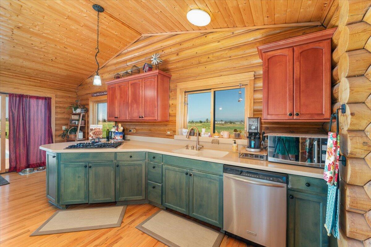 4208 Balls Ferry Road Cottonwood, CA 96022 - Photo 9 of 53 a kitchen with a sink and cabinets