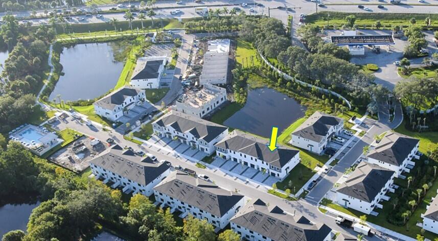 288 Southwest Sally Way, Unit LATITUDE 6112 Stuart, FL 34997 - Photo 3 of 22 an aerial view of a house with a garden