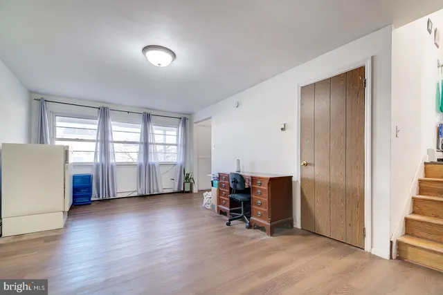 a view of room with furniture and wooden floor