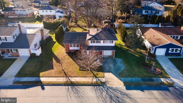 a aerial view of a house with swimming pool garden and patio