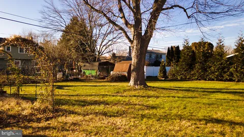 a view of a yard with swimming pool and an outdoor space