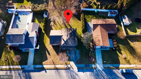 an aerial view of residential houses and outdoor space
