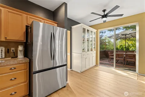 a kitchen with stainless steel appliances granite countertop a refrigerator and a sink