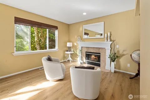 a living room with a couch and a fireplace