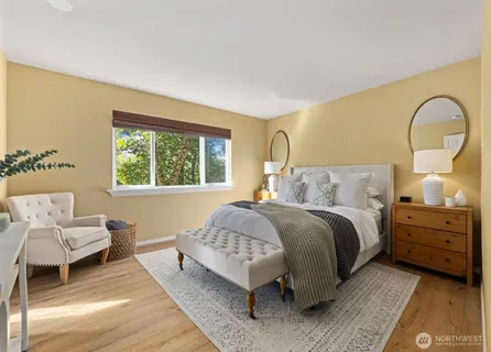 a bedroom with a bed and a couch