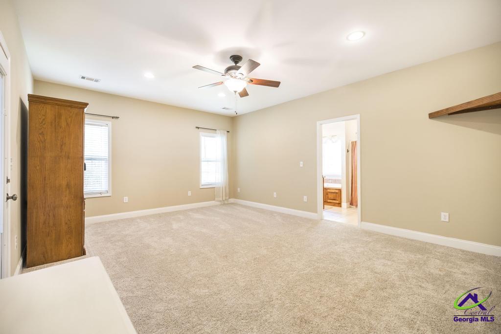 204 Smith Road Haddock, GA 31033 - Photo 19 of 51 a view of an empty room with a window