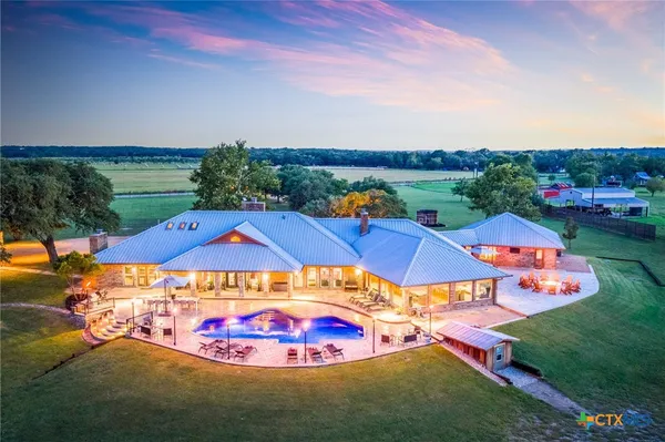 an aerial view of a house with a garden