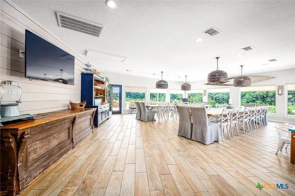 a view of a kitchen with kitchen island and a wooden floor