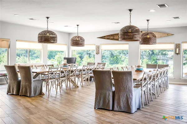 a view of a dining room with furniture window and wooden floor