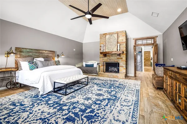 a bed room with a bed and a fireplace