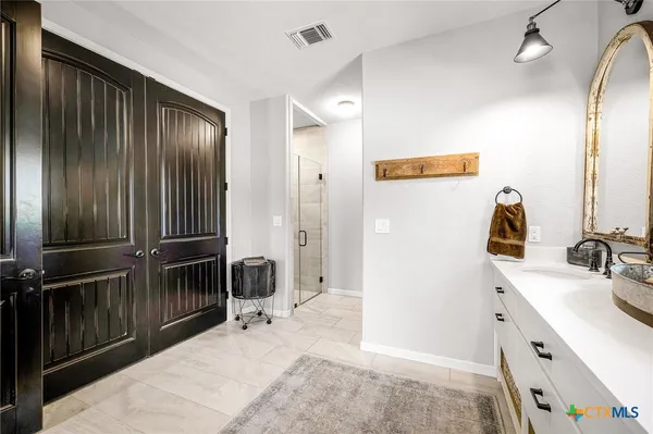 a bathroom with a sink and a mirror