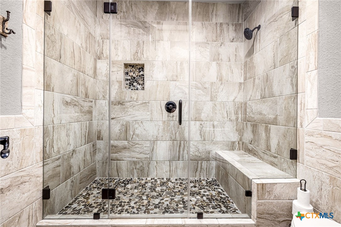871 Chimney Valley Road Blanco, TX 78606 - Photo 27 of 45 a bathroom with a shower