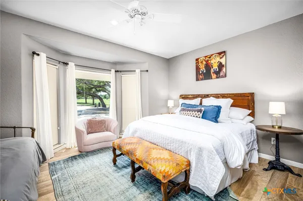 a bedroom with a bed and a couch