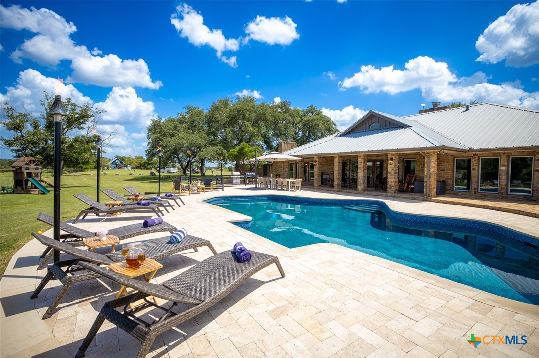 871 Chimney Valley Road Blanco, TX 78606 - Photo 8 of 45 a view of swimming pool with lounge chair
