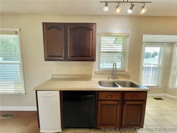 a bathroom with a sink and a window