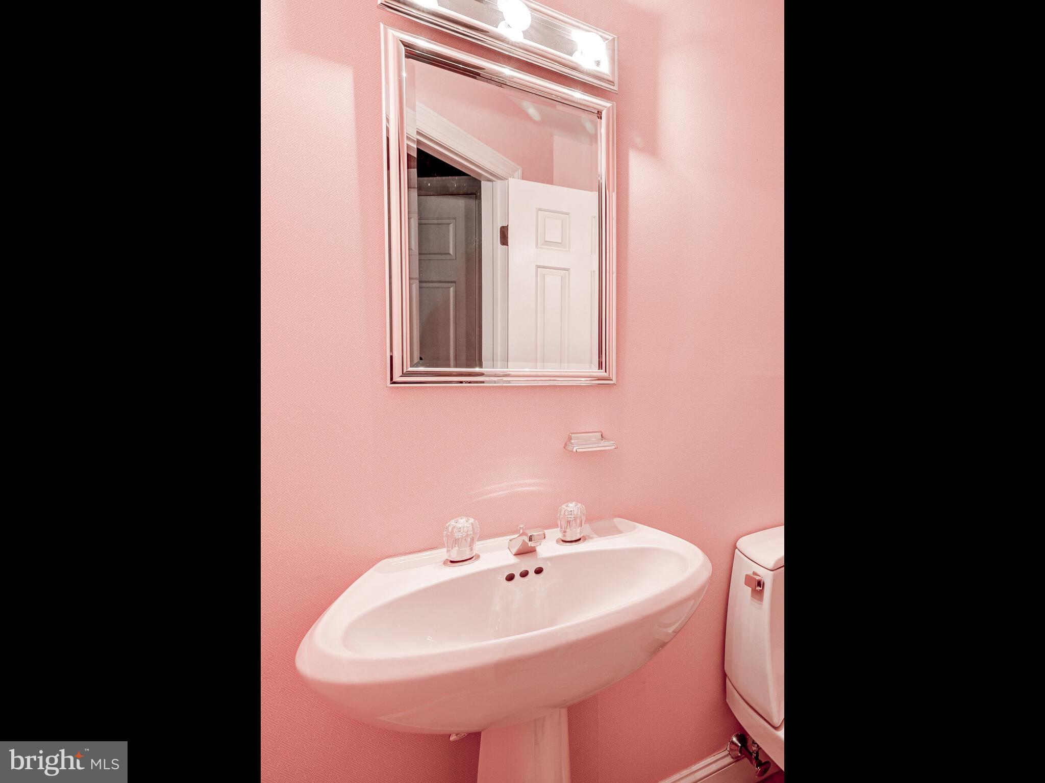 3704 North Charles Street, Unit 505 Baltimore, MD 21218 - Photo 17 of 34 a bathroom with a sink and a mirror