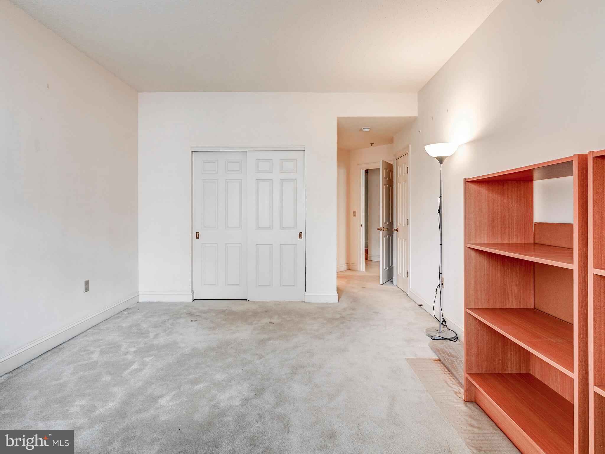 3704 North Charles Street, Unit 505 Baltimore, MD 21218 - Photo 22 of 34 a view of an empty room with a closet