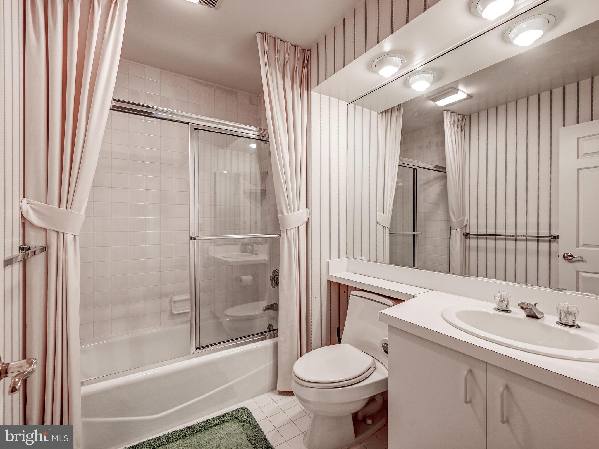 3704 North Charles Street, Unit 505 Baltimore, MD 21218 - Photo 23 of 34 a bathroom with a sink toilet and shower