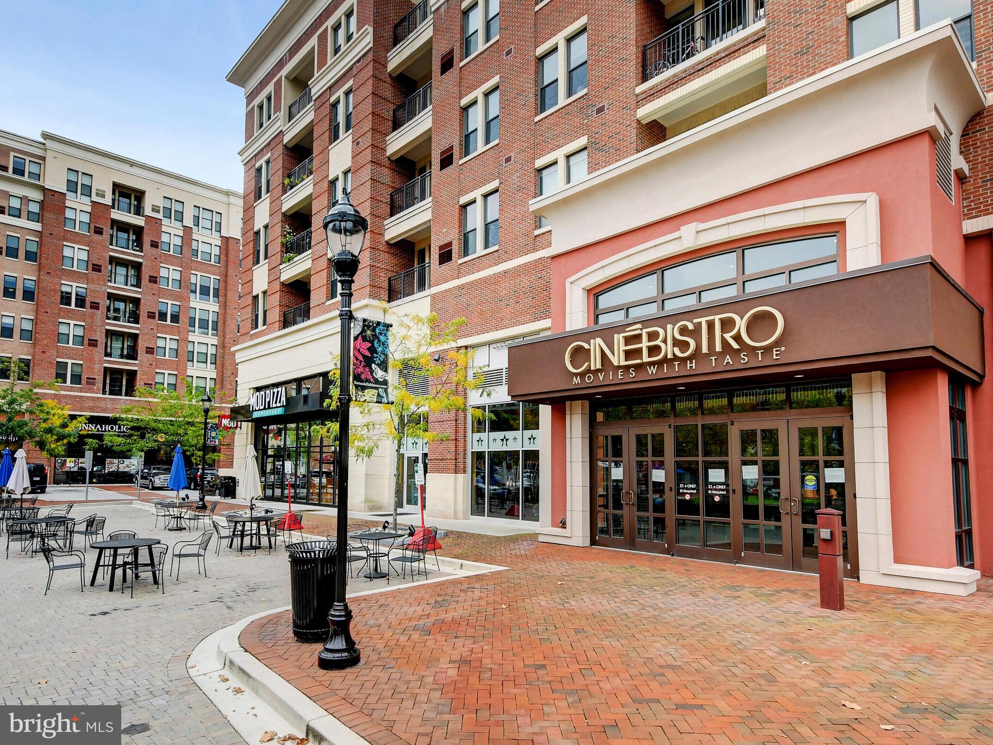 3704 North Charles Street, Unit 505 Baltimore, MD 21218 - Photo 33 of 34 a front view of multi story building with retail shops
