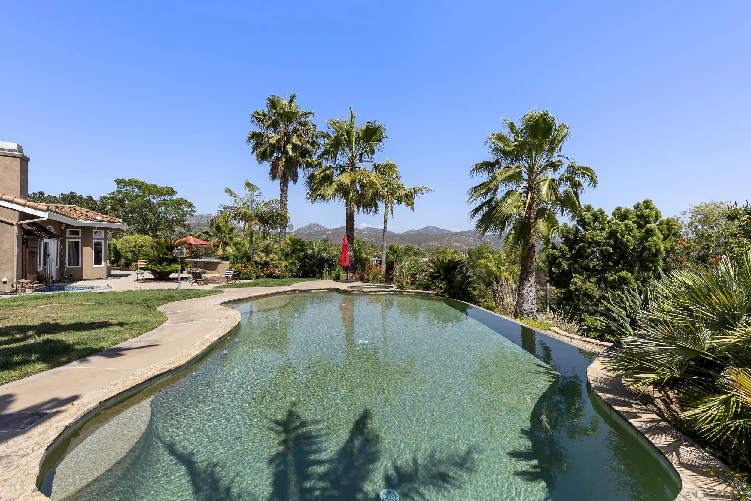 14998 Budwin Lane Poway, CA 92064 - Photo 36 of 44 a view of a swimming pool and a yard