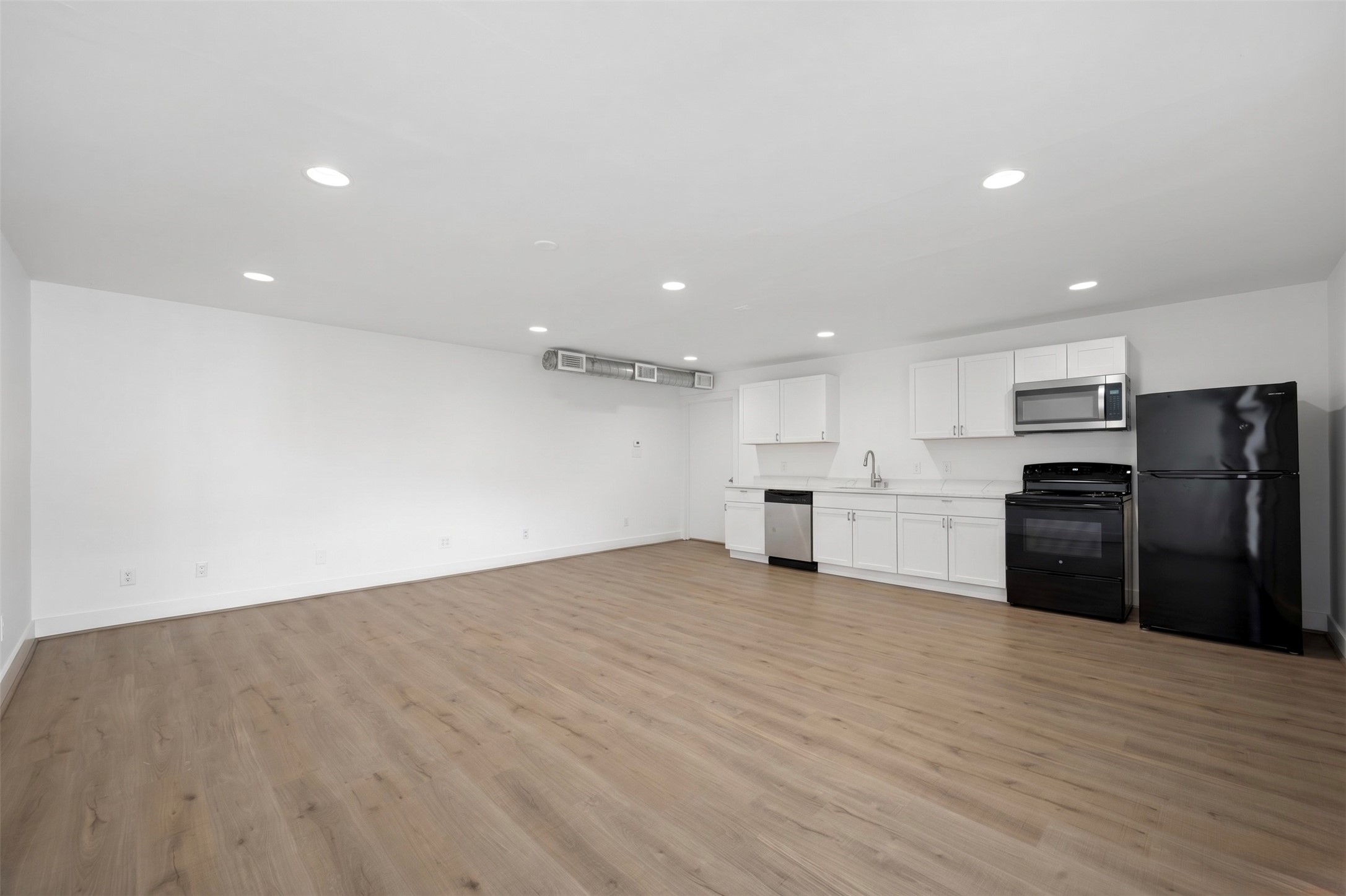 234 Westheimer Road, Unit 4 Houston, TX 77006 - Photo 13 of 16 Open Floor Plan with New Kitchen & Quartz Countertops