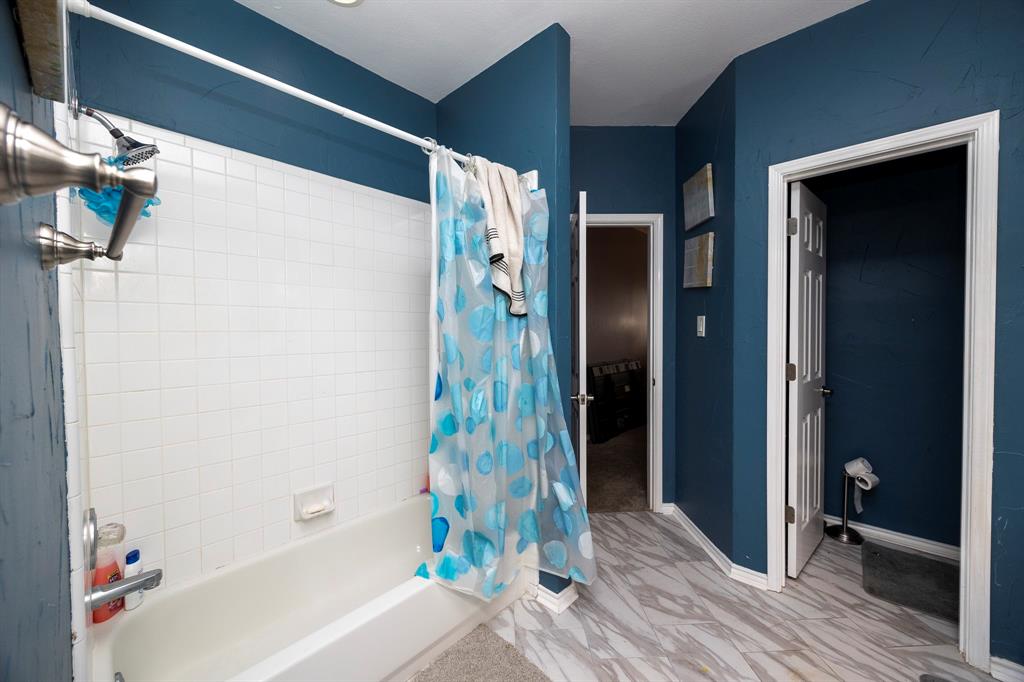 1418 Signal Ridge Place Rockwall, TX 75032 - Photo 30 of 35 White subway tile shower surround with a built-in tub