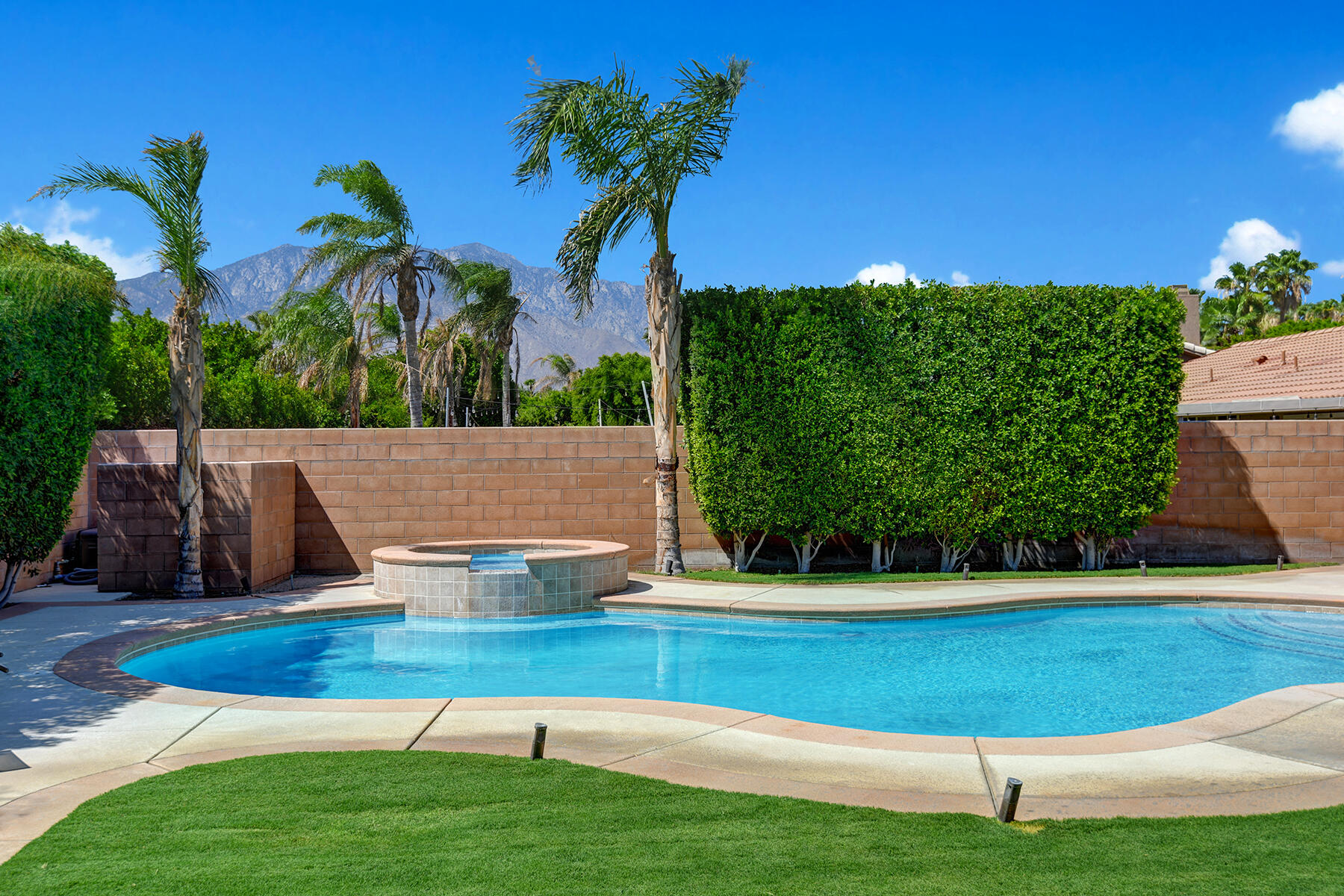 68965 Hermosillo Road Cathedral City, CA 92234 - Photo 25 of 40 a view of swimming pool with a garden